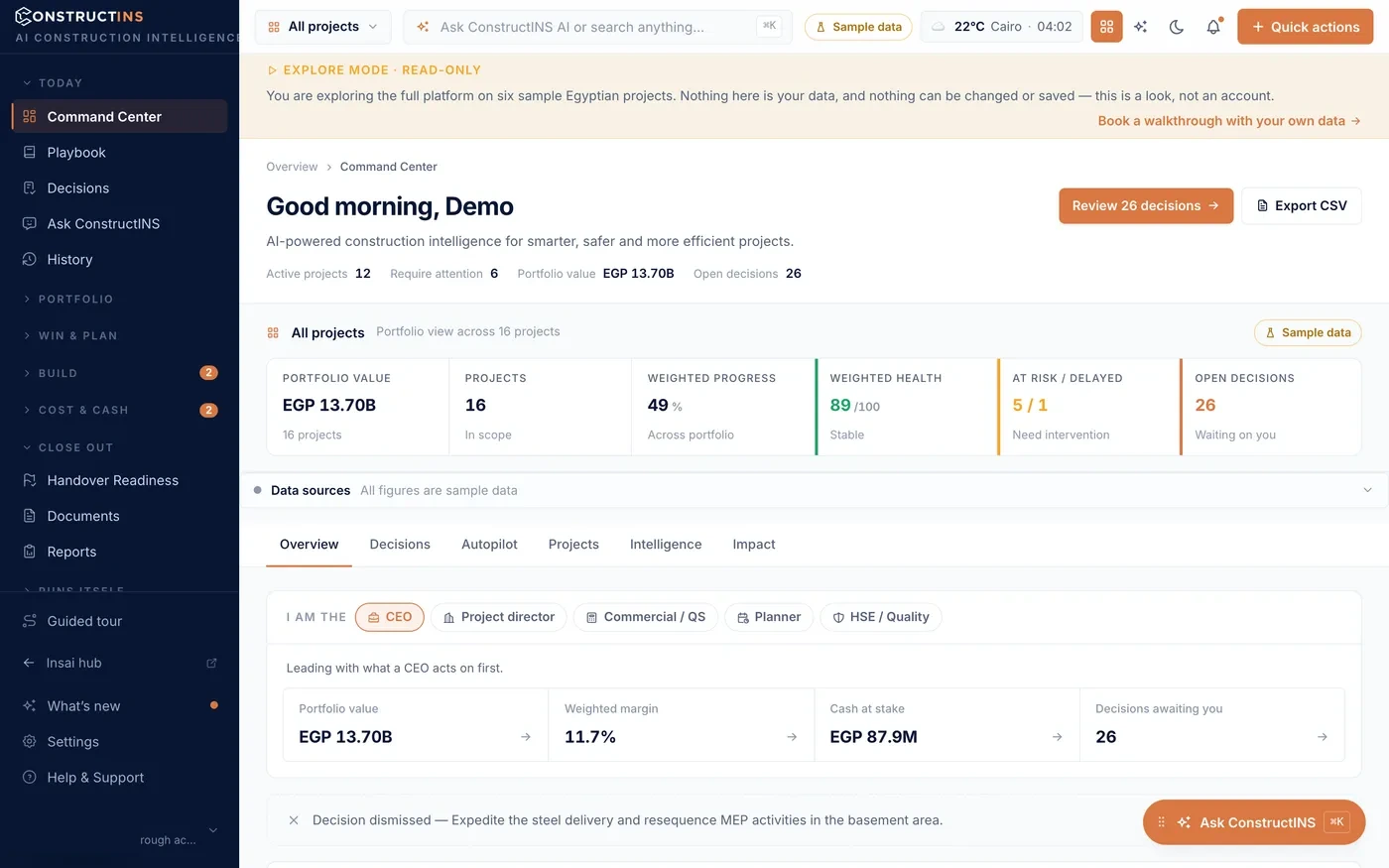 ConstructINS command center showing portfolio health, at-risk and delayed projects and pending decisions — sample data.